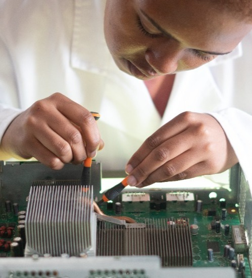 Close up of a woman doing work on a circuit board