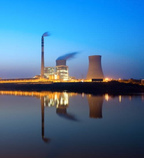 picture of a nuclear power plant at night 